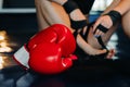 Close-up of red boxing gloves on the floor of a blue boxing ring Royalty Free Stock Photo