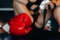 Close-up of red boxing gloves on the floor of a blue boxing ring Royalty Free Stock Photo