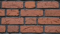 Close-up of red brick wall with dark mortar Royalty Free Stock Photo