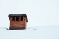 Close up on red bricked chimney on snowy rooftop