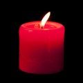 Red candle lit in the dark Royalty Free Stock Photo