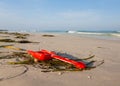 Close up of red childs spade on sandy beach Royalty Free Stock Photo