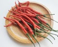 Close-up of red chili peppers in a plate on a white background. Royalty Free Stock Photo