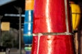 Close-up of a red clinkered column at the entrance of the train station designed by artist Friedensreich Hundertwasser in Uelzen,
