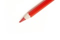 Close up of a red color pencil seen from a high angle on a white background Royalty Free Stock Photo