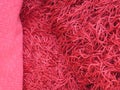 Close-up of a red colored high pile carpet