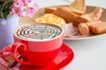 Close up red cup of coffee and breadfast Royalty Free Stock Photo