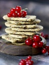 Close up of red currant cookies. No sugar berry crackers made of whole grain flour, sweetener and fresh berries, healthy snack.