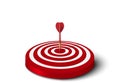 Close up of red dart hit to center of red dartboard on the floor. Arrow on bullseye in target. Business success, investment goal, Royalty Free Stock Photo