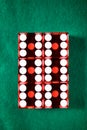 Close-up of a red dices on a green mat Royalty Free Stock Photo