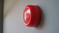 Close-up of red fire alarm mounted on gray wall Royalty Free Stock Photo