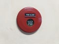 Red fire alarm round box on the wall Royalty Free Stock Photo