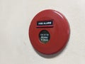 Red fire alarm round box on the wall Royalty Free Stock Photo