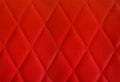 Close up Red genuine leather sofa. Retro chesterfield style