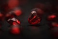 Close-up on a red glass hearts on a dark background. Valentine\'s concept. Symbol of love and Valentine\'s day. Royalty Free Stock Photo