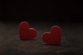 Close-up on a red glass hearts on a dark background. Valentine\'s concept. Symbol of love and Valentine\'s day. Royalty Free Stock Photo