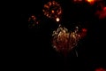 Close-up red and gold festive fireworks on black background. Abstract holiday background Royalty Free Stock Photo