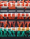 Close up of red and green network cables connected to switch Royalty Free Stock Photo