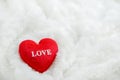 Close up of red heart with white love pattern on white furry background Royalty Free Stock Photo