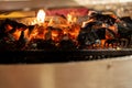 Close up of red hot glowing charcoal embers with white ash in a BBQ grill Royalty Free Stock Photo