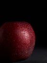 Close-up of Red juicy Apple with drops of water on a Black Background Royalty Free Stock Photo