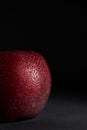 Close-up of Red juicy Apple with drops of water on a Black Background Royalty Free Stock Photo