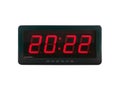 Red led light numbers 2022 illuminated on black digital electric alarm clock display isolated on white background Royalty Free Stock Photo