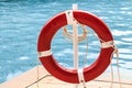 Close up of red life ring at the pool Royalty Free Stock Photo