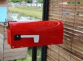 A close up of the red mailbox  Stuck at the front of the house  Mailing concept. Royalty Free Stock Photo