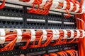 Close up of red network cables connected to switch Royalty Free Stock Photo