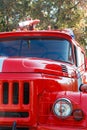 Close-up of red old vintage fire truck. Front view Royalty Free Stock Photo