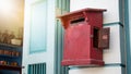 Close up of red old vintage wooden mailbox in front of vintage store. Royalty Free Stock Photo