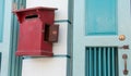 Close up of red old vintage wooden mailbox in front of vintage store. Royalty Free Stock Photo