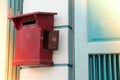 Close up of red old vintage wooden mailbox in front of vintage store. Royalty Free Stock Photo