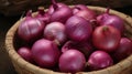 Close up of red onions beautifully arranged in a woven basket Royalty Free Stock Photo