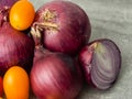 Close-up of red onions and yellow snack tomatoes Royalty Free Stock Photo