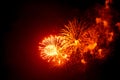 Close-up red and orange festive fireworks on black background. Abstract holiday background Royalty Free Stock Photo