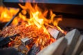 close-up of red and orange flames dancing over firewood Royalty Free Stock Photo