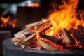 close-up of red and orange flames dancing over firewood Royalty Free Stock Photo