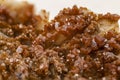 close up of red orange tabular crystals of vanadinite. Lead mineral sample belonging to the eighth class