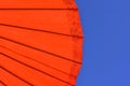 Close-up of a red parasol umbrella against the blue sky Royalty Free Stock Photo