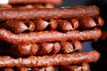 Close up of red pepper dried sausages on farmer market for sale Royalty Free Stock Photo