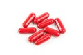 Red pill capsules on white background. Royalty Free Stock Photo