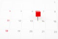 Close up red pin on White Calendar. Royalty Free Stock Photo