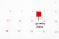 Close up red pin on White Calendar. Royalty Free Stock Photo