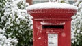 Close up of a Red post box in the snow at Christmas Royalty Free Stock Photo