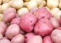 Close up of red potatoes with brown potatoes in background