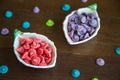 Close up red and purple homemade Allure Thai candy in a mini bowl on a rustic wooden table, Allure is traditional Thai desserts