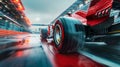 Close-up of red racing car wheel moving on high speed on wet race track with blurred tribune on background. Concept of Royalty Free Stock Photo