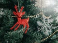 Close-up red reindeer ornament on Christmas tree background Royalty Free Stock Photo